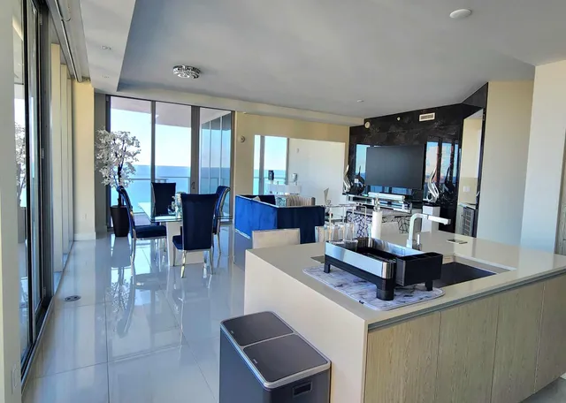 a view of a dining room with furniture window and outside view