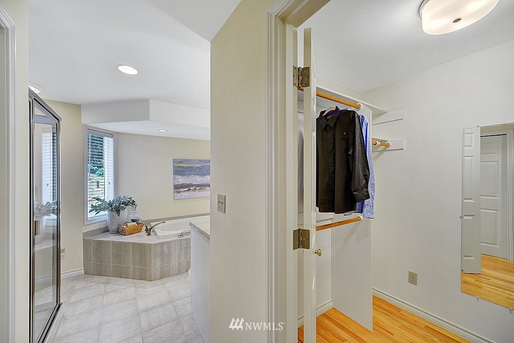 4402 Southwest Rose Street Seattle, WA 98136 - Photo 11 of 20 a bathroom with a tub sink and mirror