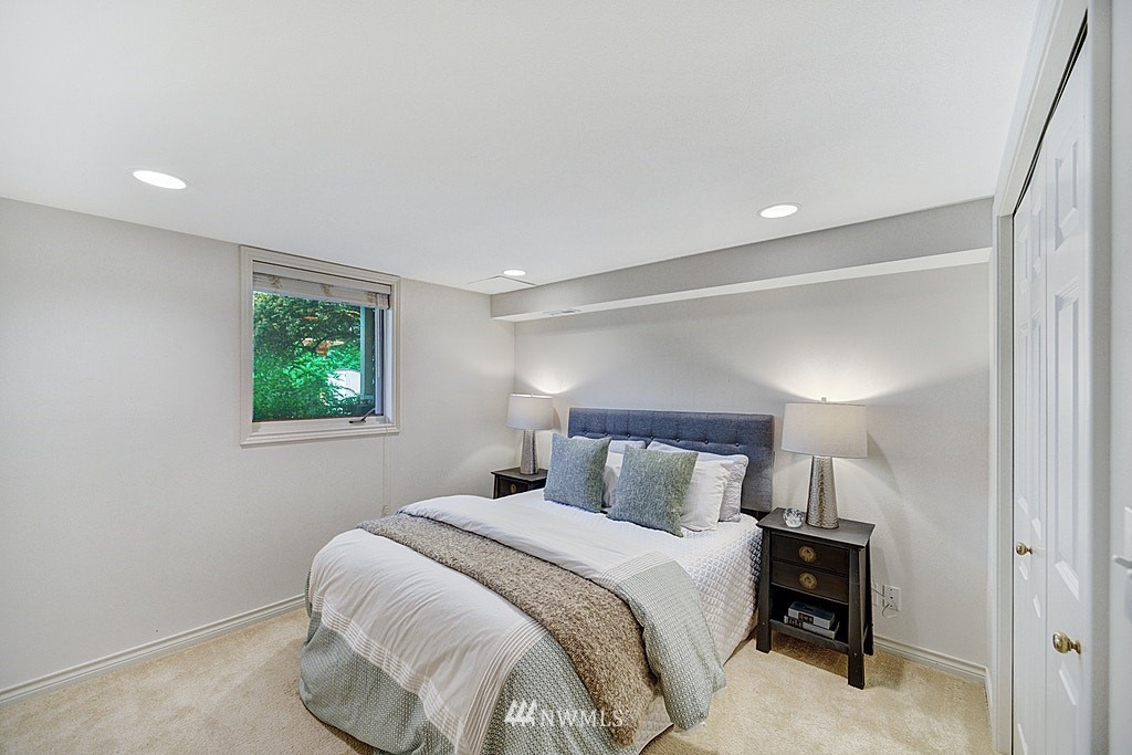 4402 Southwest Rose Street Seattle, WA 98136 - Photo 18 of 20 a bedroom with a bed and a window