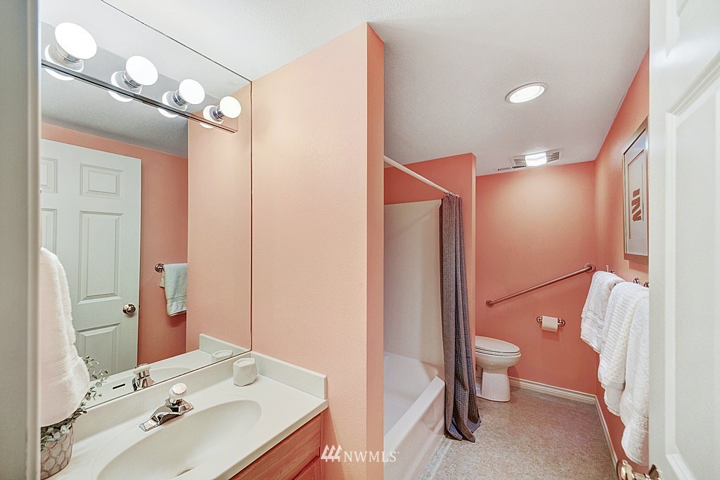 4402 Southwest Rose Street Seattle, WA 98136 - Photo 20 of 20 a bathroom with a sink and a mirror