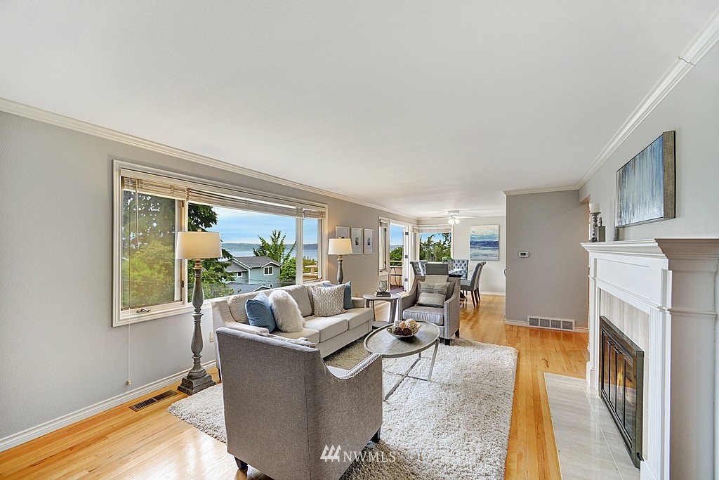 4402 Southwest Rose Street Seattle, WA 98136 - Photo 3 of 20 a living room with furniture and a fireplace