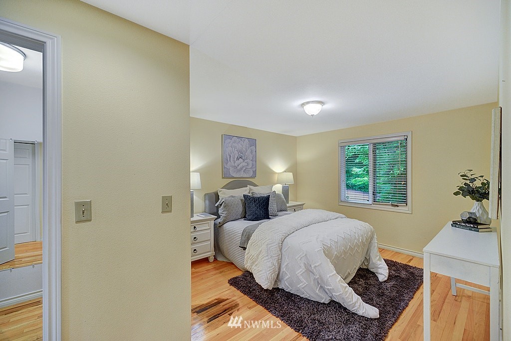 4402 Southwest Rose Street Seattle, WA 98136 - Photo 10 of 20 a bedroom with a bed and window