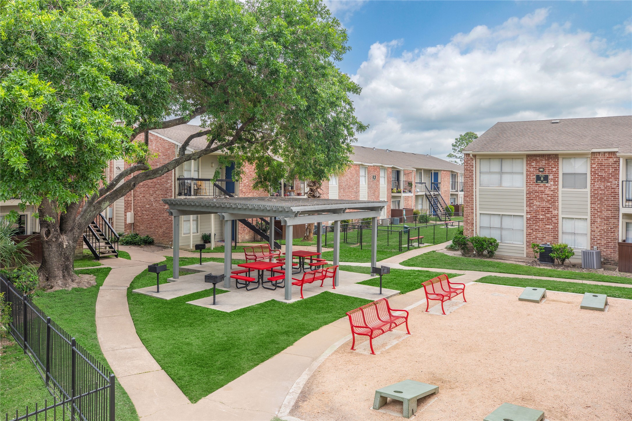 3401 Ocee Street, Unit 304 Houston, TX 77063 - Photo 6 of 6 a view of a house with a yard table and chairs