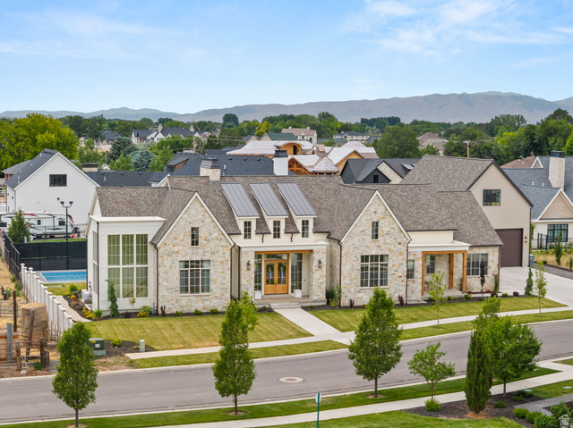 478 South Maple Lakes Drive Mapleton, UT 84664 - Photo 48 of 51 Contemporary residence featuring a stone and stucco exterior, prominent gables, and solar panels