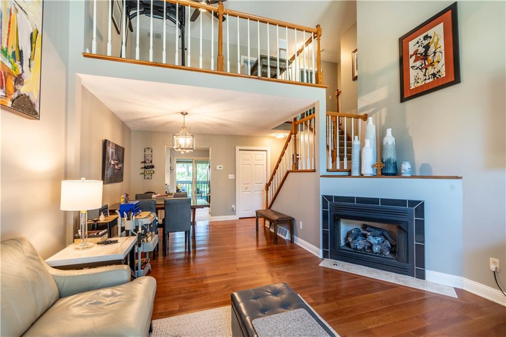 228 Country View Drive Lower Burrell, PA 15068 - Photo 5 of 49 a living room with furniture a fireplace and a large window