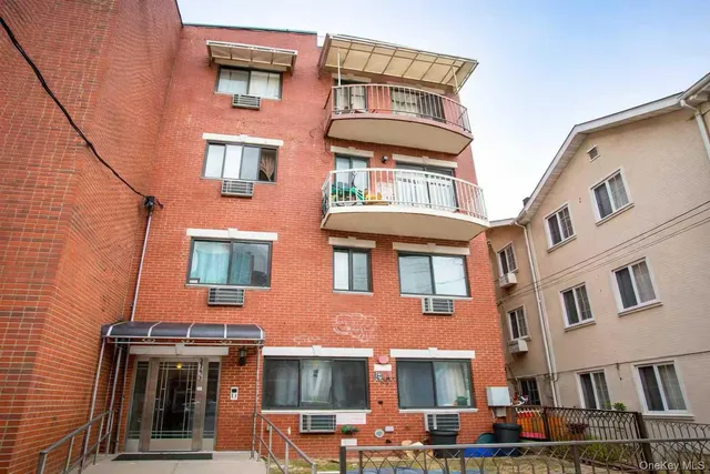 a front view of residential houses with stairs