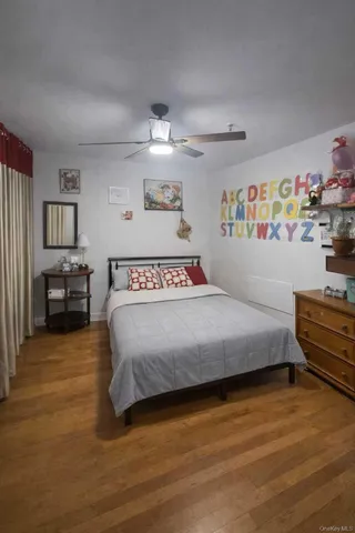 a bedroom with a bed and dresser