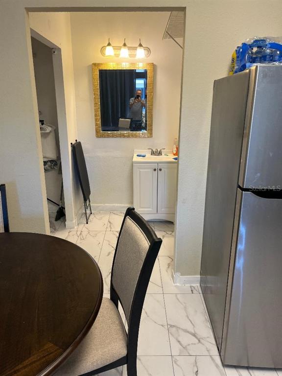 8421 South Orange Blossom Trail, Unit 248 Orlando, FL 32809 - Photo 5 of 10 a view of a living room with furniture and a flat screen tv