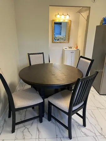 a view of a dining room with furniture