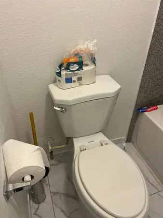 a bathroom with a toilet and a sink