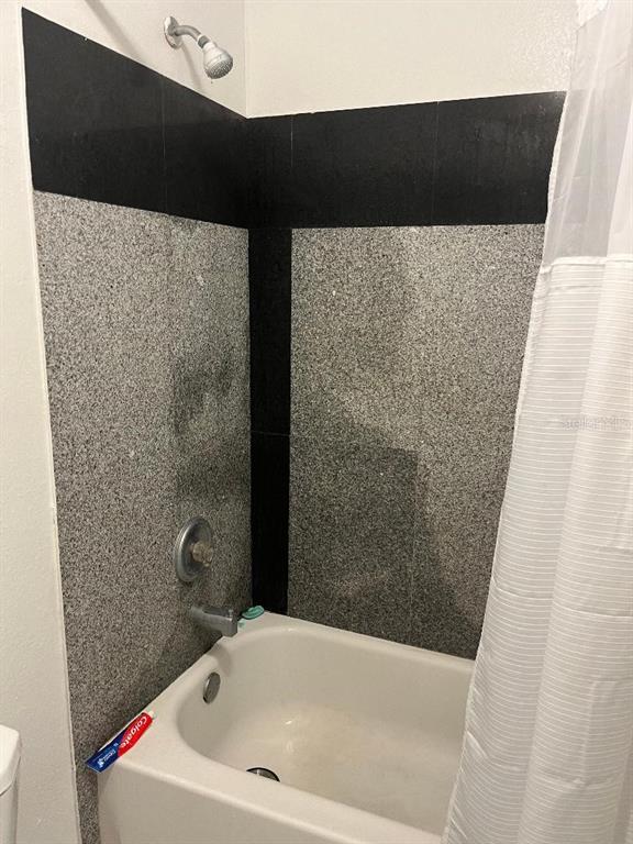 8421 South Orange Blossom Trail, Unit 248 Orlando, FL 32809 - Photo 10 of 10 a bathroom with a bathtub