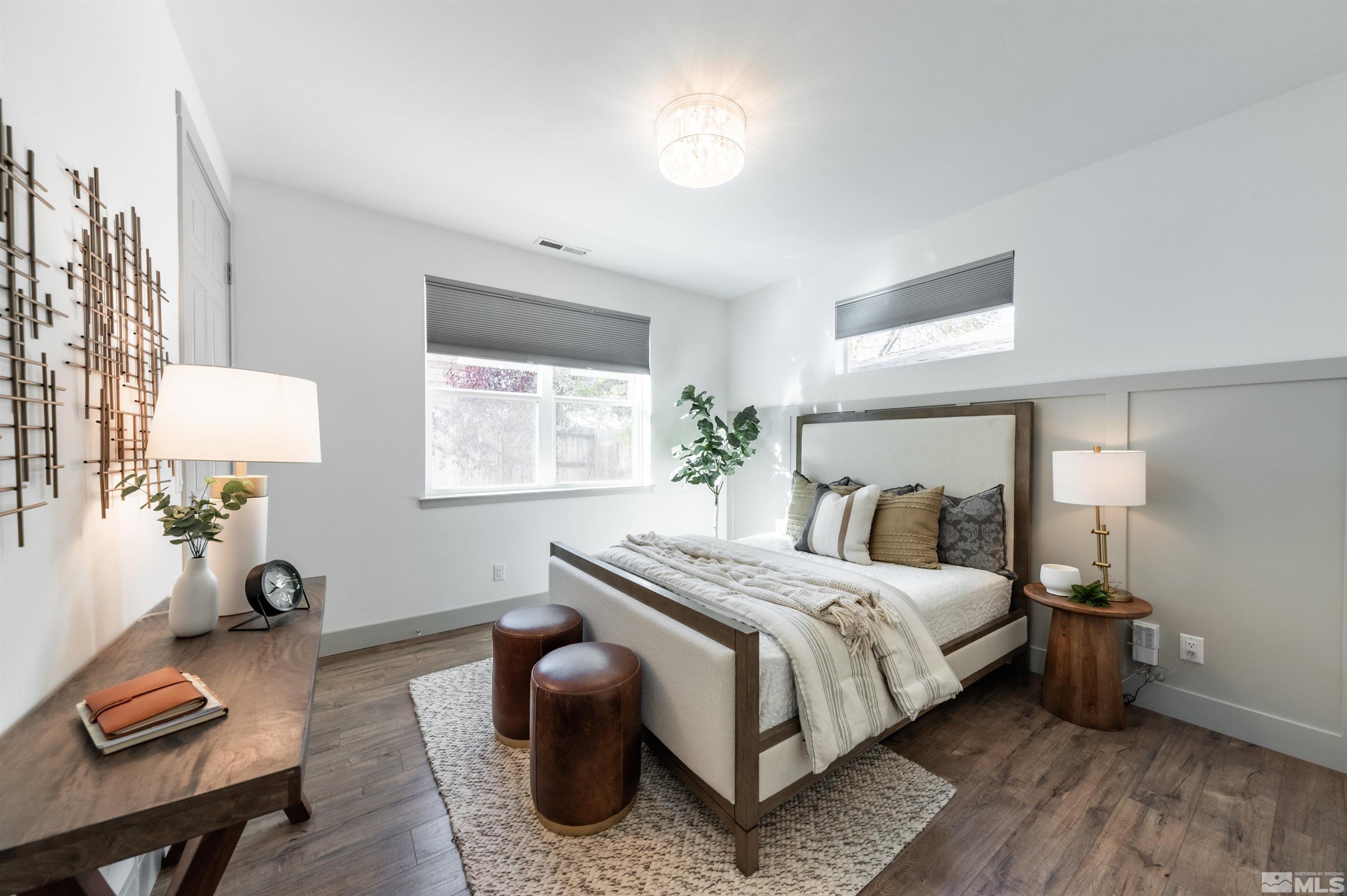 1217 Lander Street Reno, NV 89509 - Photo 8 of 21 a bedroom with a bed and a lamp on table