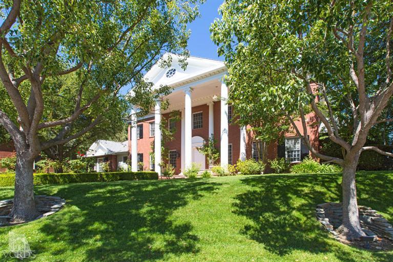 2702 Ladbrook Way Thousand Oaks, CA 91361 - Photo 2 of 45 a view of a white house with a big yard and large trees