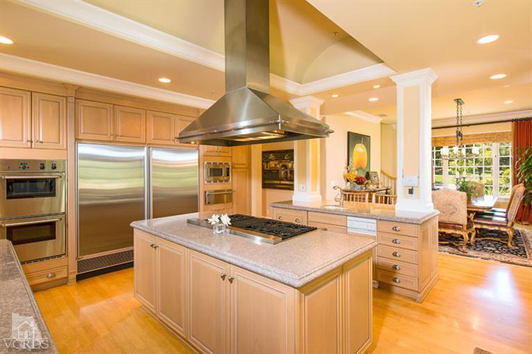 2702 Ladbrook Way Thousand Oaks, CA 91361 - Photo 12 of 45 a kitchen with stainless steel appliances kitchen island granite countertop a sink and cabinets