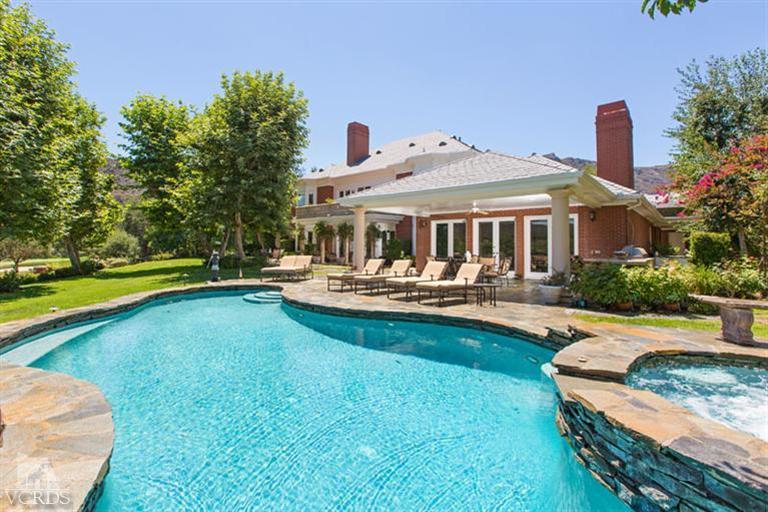 2702 Ladbrook Way Thousand Oaks, CA 91361 - Photo 29 of 45 a view of a house with swimming pool and porch with furniture