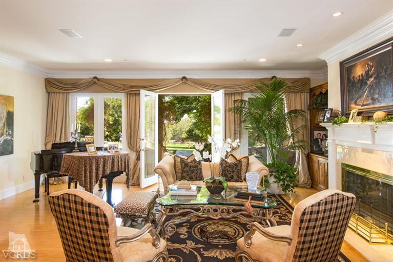 2702 Ladbrook Way Thousand Oaks, CA 91361 - Photo 7 of 45 a living room with furniture fireplace and large windows
