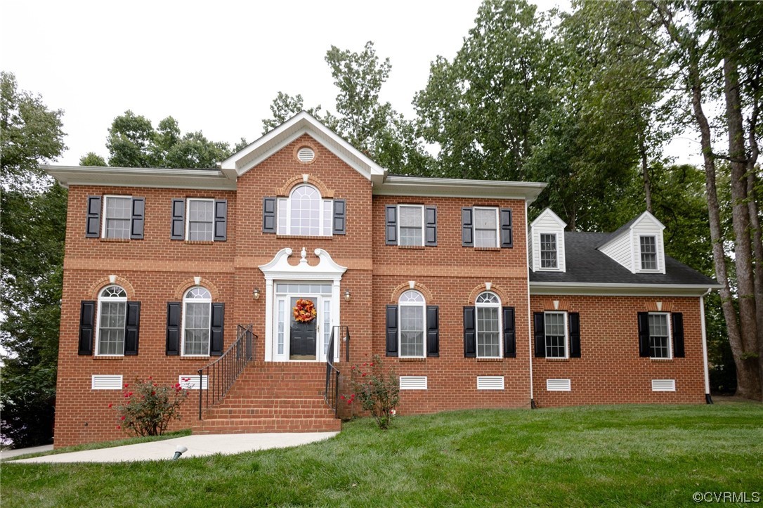 12904 Chipstead Road Chester, VA 23831 - Photo 1 of 50 front view of house that has a yard