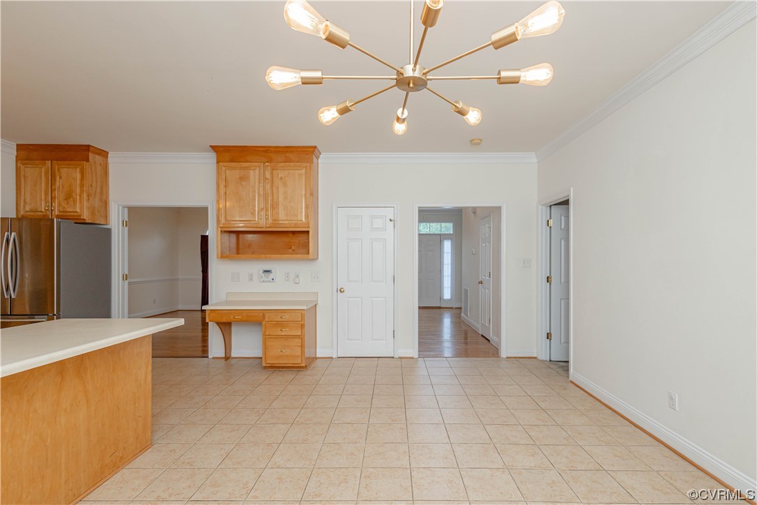12904 Chipstead Road Chester, VA 23831 - Photo 11 of 50 a view of a kitchen with a sink and a refrigerator