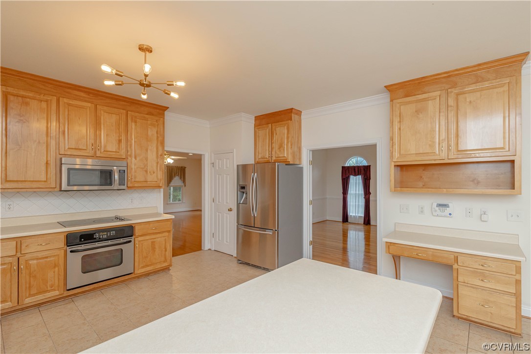 12904 Chipstead Road Chester, VA 23831 - Photo 12 of 50 a kitchen with stainless steel appliances granite countertop a refrigerator and a stove top oven