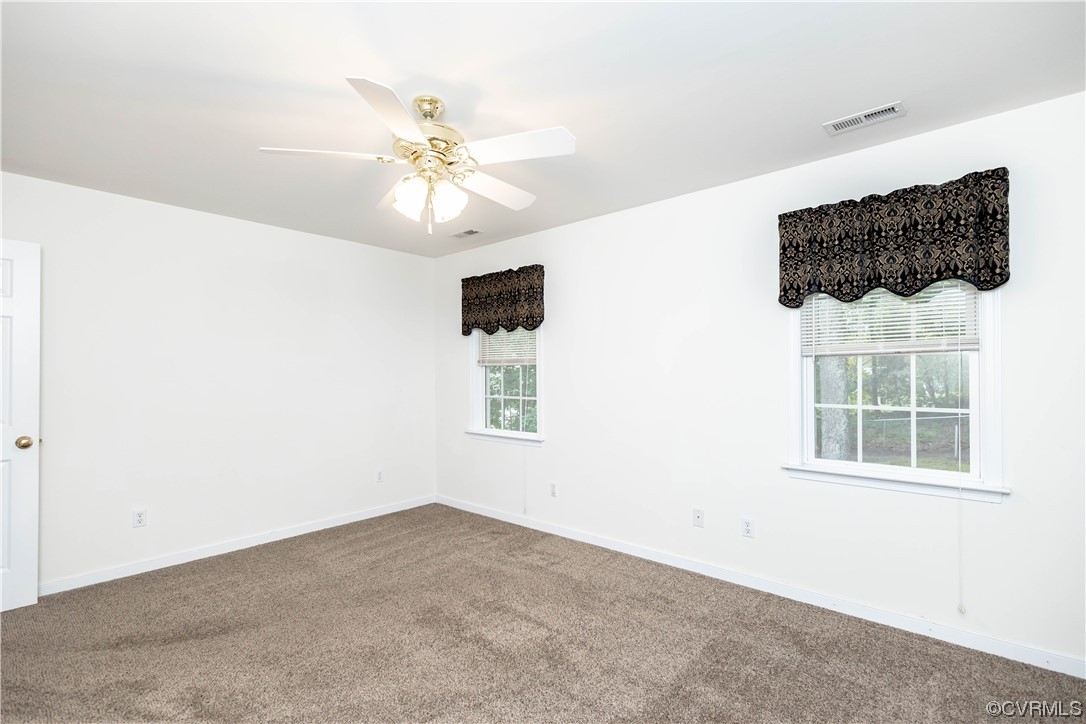 12904 Chipstead Road Chester, VA 23831 - Photo 24 of 50 a view of a livingroom with a ceiling fan and window