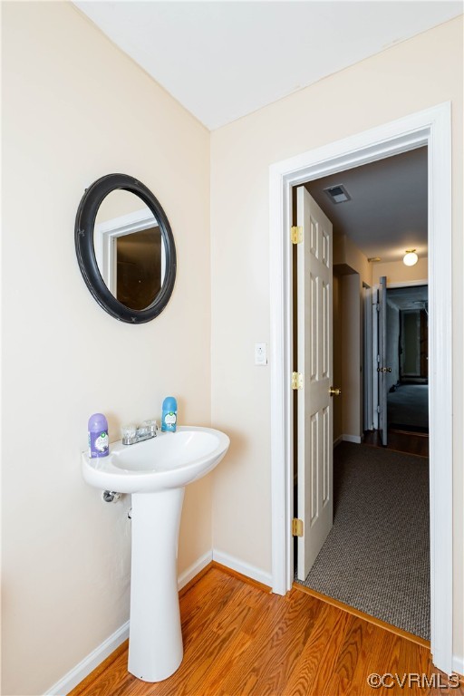 12904 Chipstead Road Chester, VA 23831 - Photo 26 of 50 a bathroom with a sink a mirror and toilet