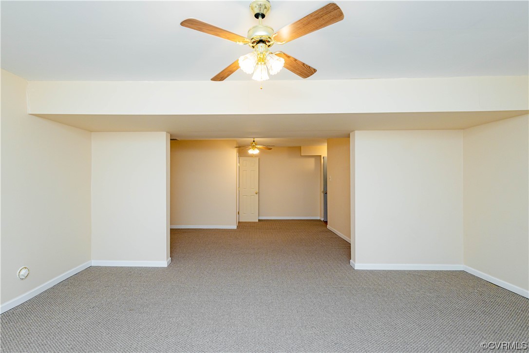 12904 Chipstead Road Chester, VA 23831 - Photo 42 of 50 an empty room with a window and a ceiling fan