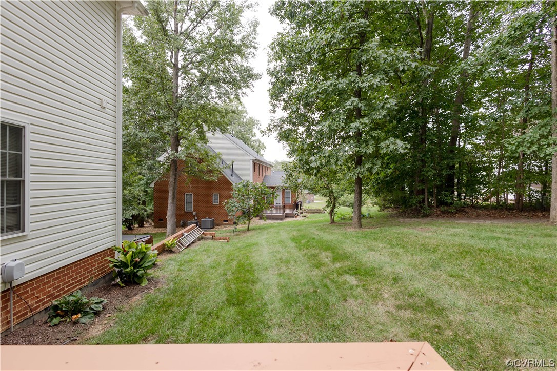 12904 Chipstead Road Chester, VA 23831 - Photo 48 of 50 a view of a back yard of the house