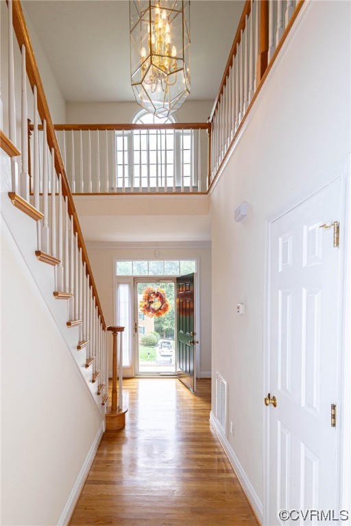 12904 Chipstead Road Chester, VA 23831 - Photo 5 of 50 a view of staircase with lots of frames and wooden floor