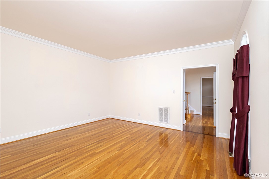 12904 Chipstead Road Chester, VA 23831 - Photo 8 of 50 a view of empty room with wooden floor and fan