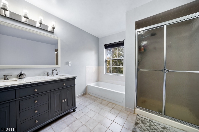 42 Springfield Road North Brunswick, NJ 08902 - Photo 16 of 29 a spacious bathroom with a tub sink shower and mirror