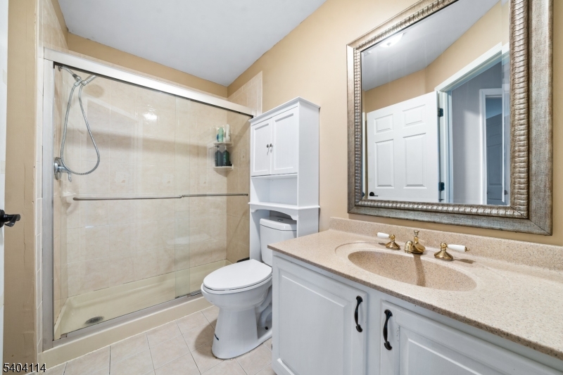 42 Springfield Road North Brunswick, NJ 08902 - Photo 17 of 29 a bathroom with a sink a toilet and shower