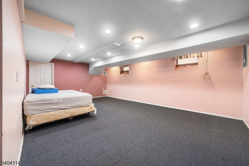 42 Springfield Road North Brunswick, NJ 08902 - Photo 22 of 29 a spacious bedroom with a bed and a large window