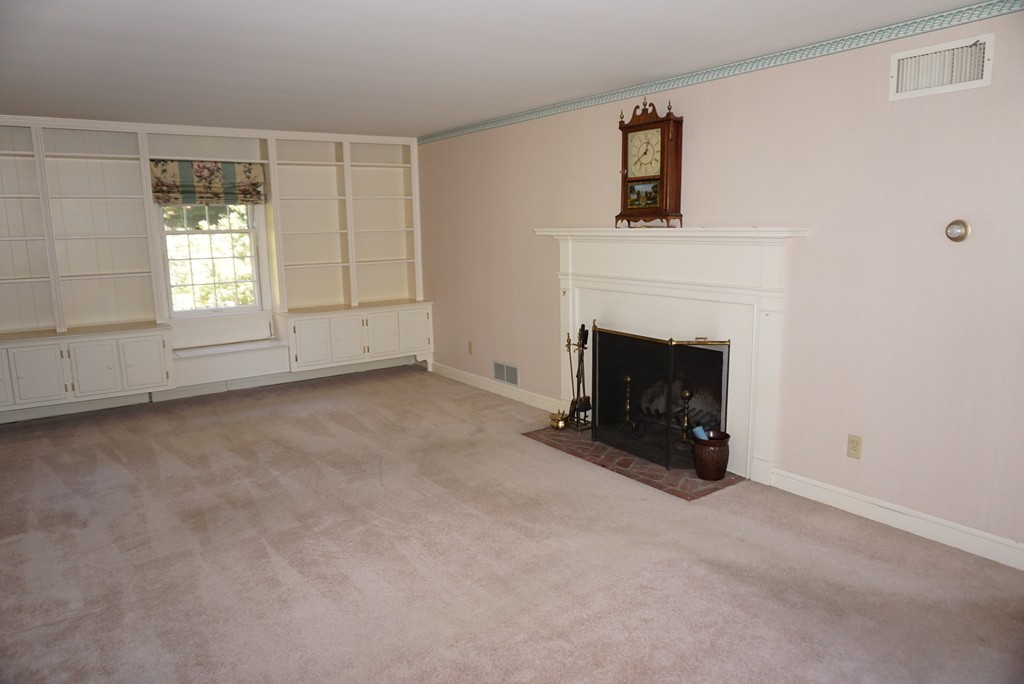32 McGregory Road Sturbridge, MA 01566 - Photo 11 of 28 an empty room with windows and fireplace