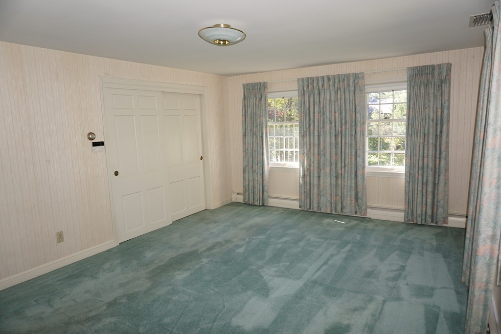 32 McGregory Road Sturbridge, MA 01566 - Photo 16 of 28 a view of an empty room with a window
