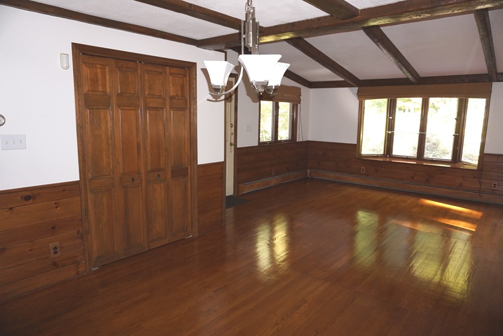 32 McGregory Road Sturbridge, MA 01566 - Photo 2 of 28 a view of empty room with wooden floor and fan