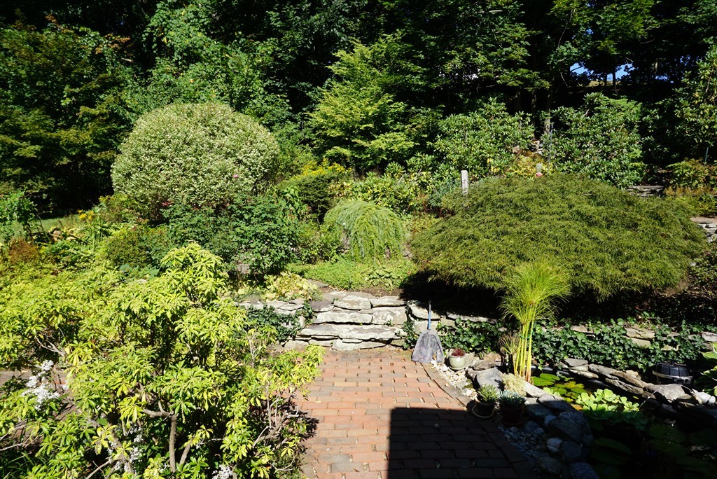 32 McGregory Road Sturbridge, MA 01566 - Photo 24 of 28 a view of a back yard of the house and green space