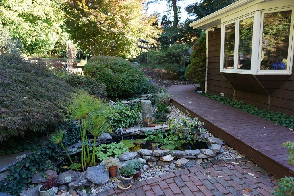 32 McGregory Road Sturbridge, MA 01566 - Photo 27 of 28 a view of house with backyard and garden