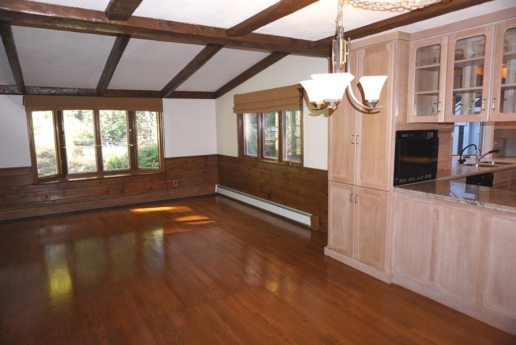 32 McGregory Road Sturbridge, MA 01566 - Photo 5 of 28 a view of empty room with wooden floor and fan