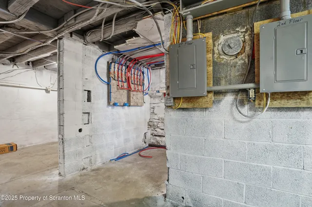 a kitchen with a refrigerator and a stove top oven