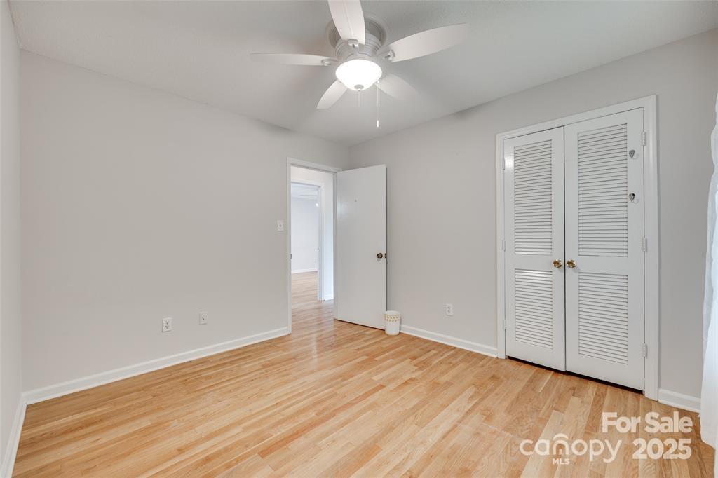810 Applegate Court Gastonia, NC 28054 - Photo 15 of 31 a view of an empty room with wooden floor