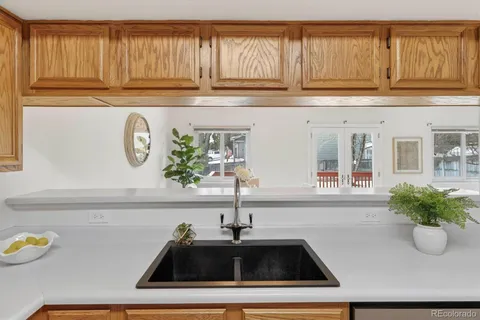 a kitchen with a sink and a window