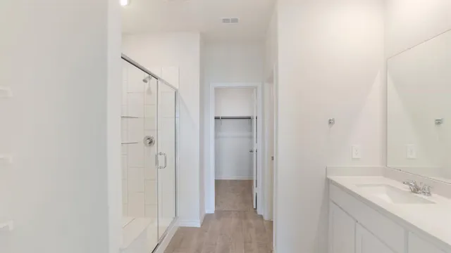 a view of a bathroom from a hallway