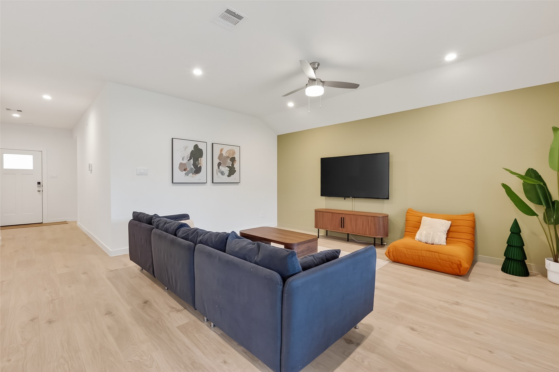 3903 Dodington Ash Drive Fulshear, TX 77441 - Photo 20 of 46 a living room with furniture and a flat screen tv