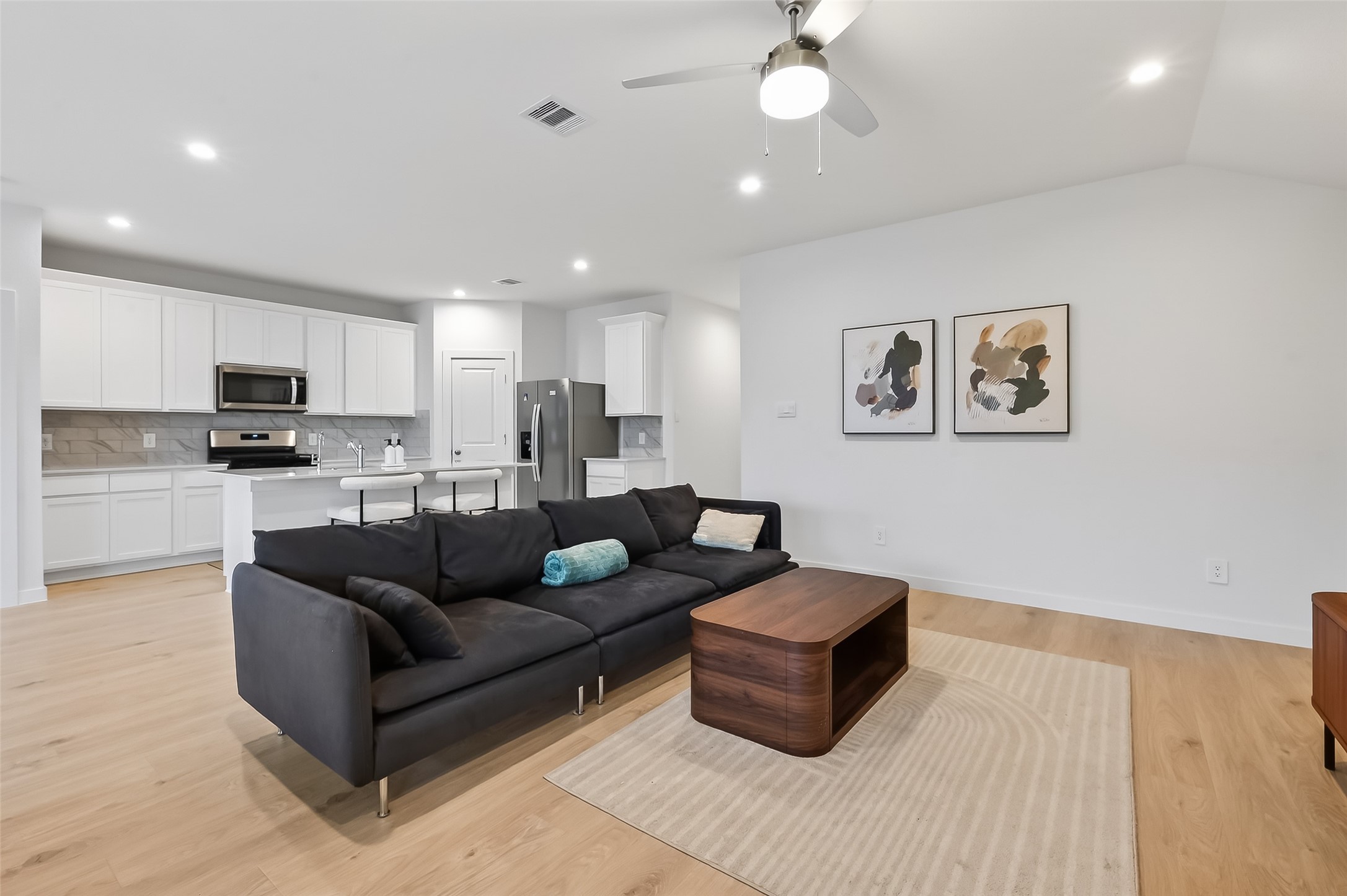 3903 Dodington Ash Drive Fulshear, TX 77441 - Photo 23 of 46 a living room with furniture and kitchen view