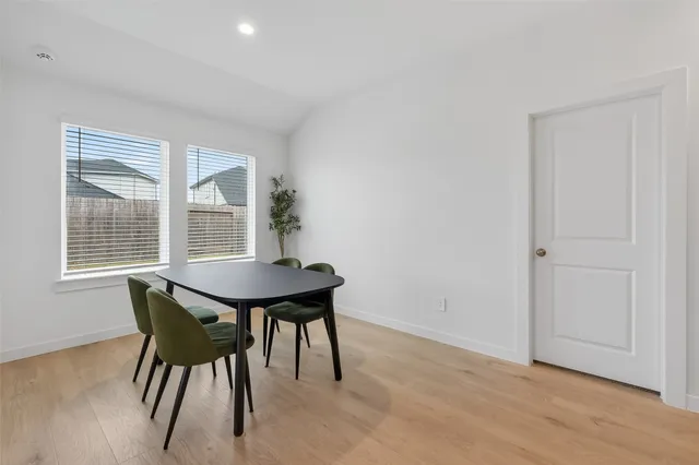 a view of a table and chairs in a room