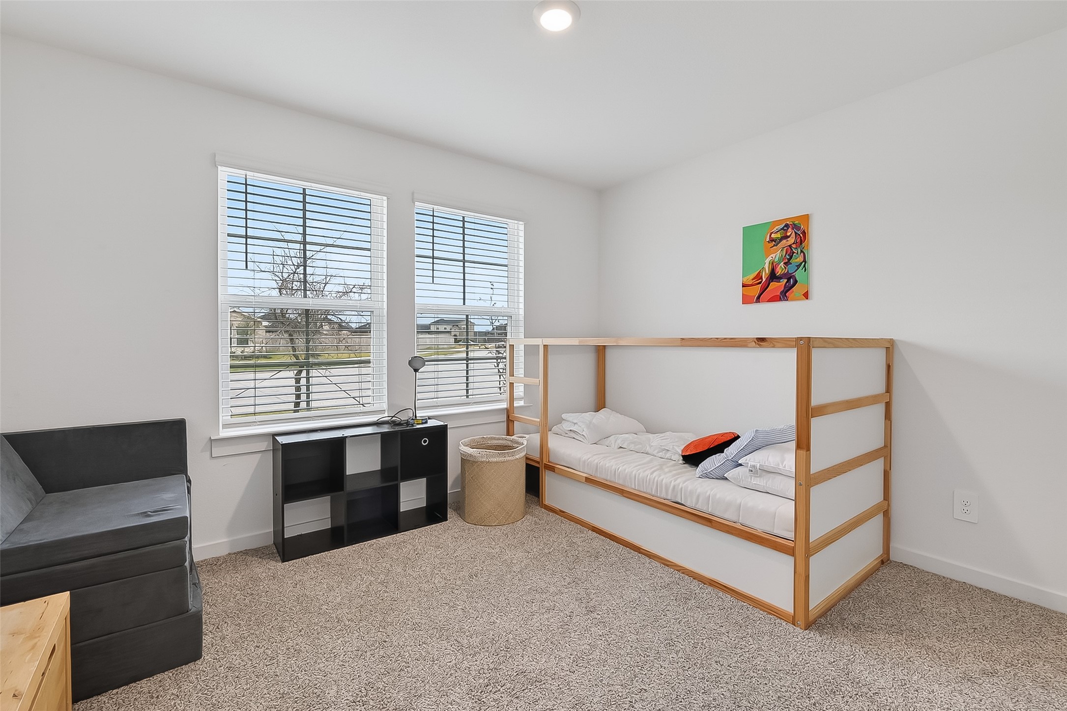 3903 Dodington Ash Drive Fulshear, TX 77441 - Photo 28 of 46 a living room with furniture and a flat screen tv