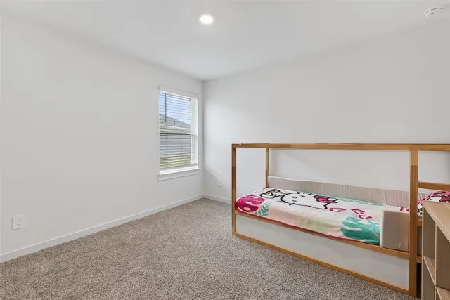 a room with toys and a dresser