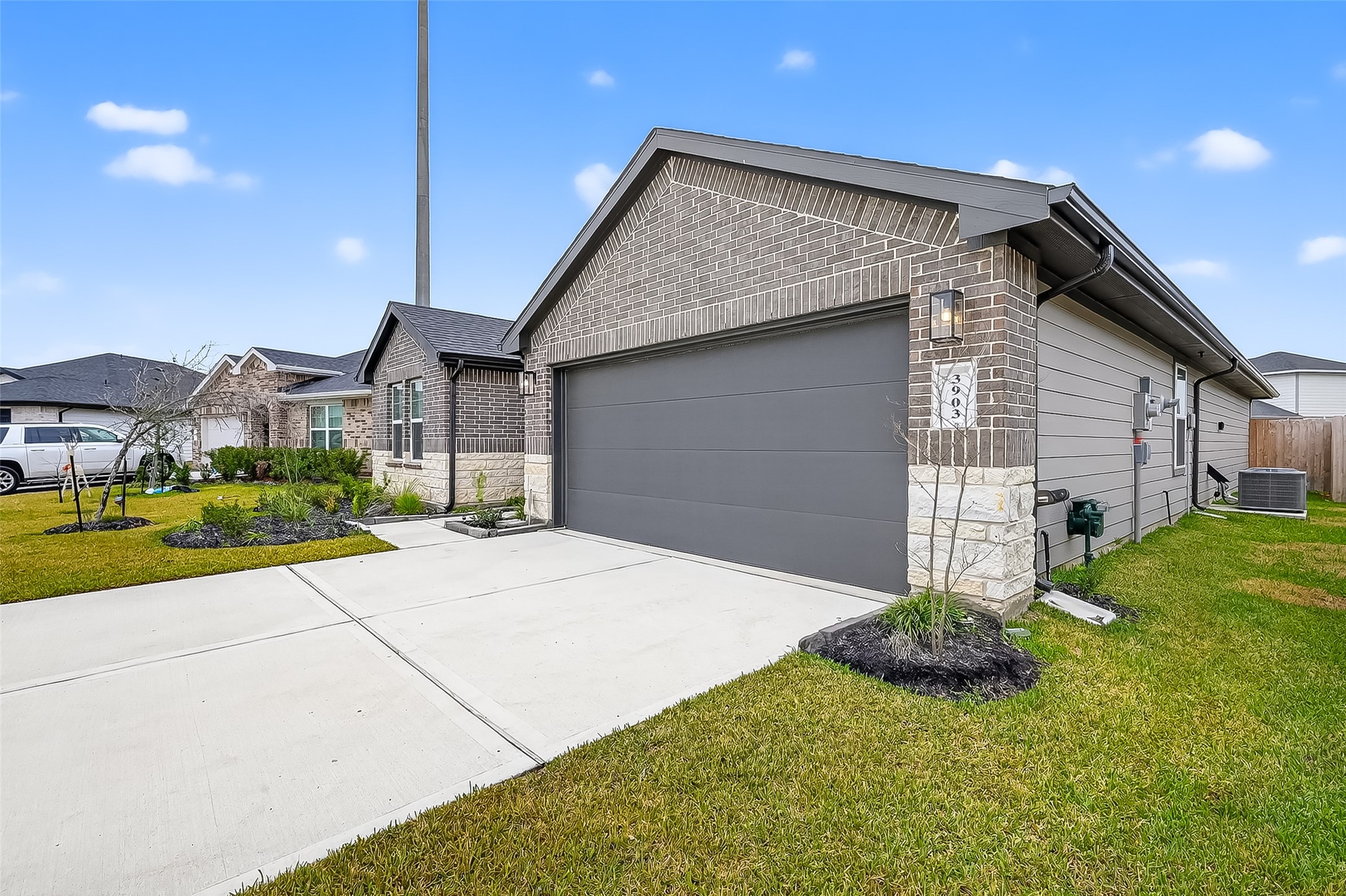 3903 Dodington Ash Drive Fulshear, TX 77441 - Photo 6 of 46 a front view of a house with a yard and garage