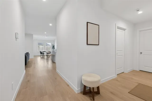 a view of a room with a bench wooden floor and a sink
