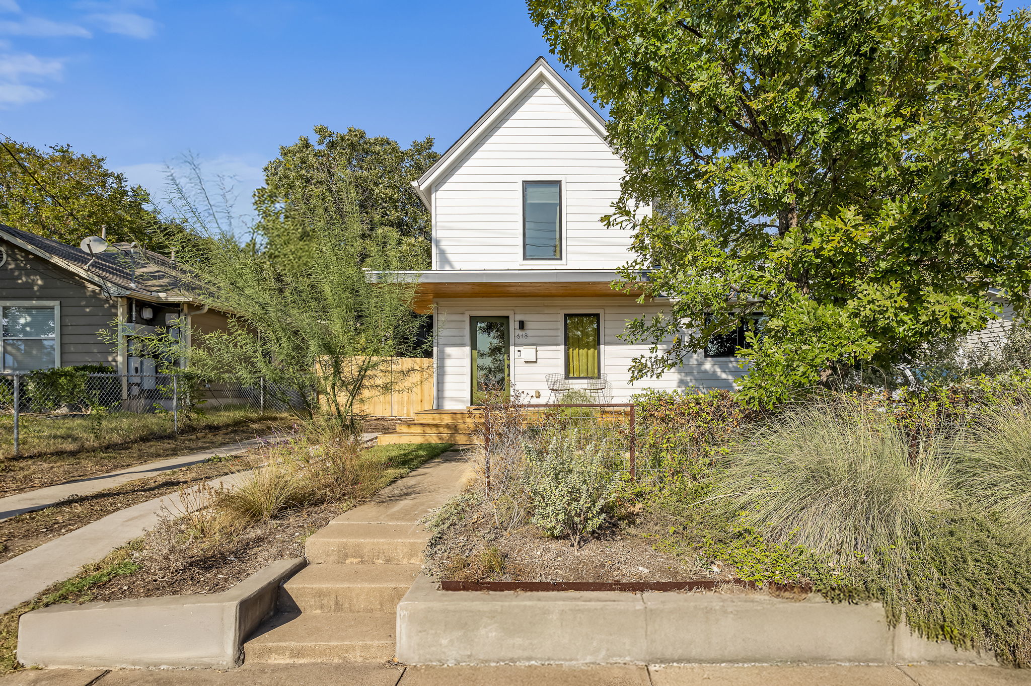 618 Denson Drive Austin, TX 78752 - Photo 2 of 35 a front view of a house with garden